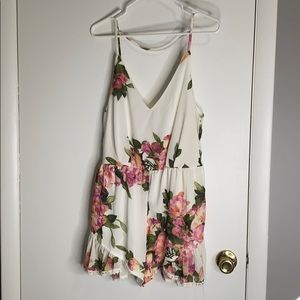 Reverse floral strappy back romper